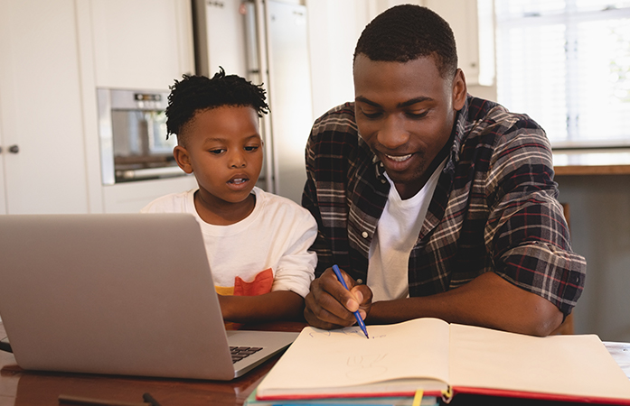 Father and son at computer 